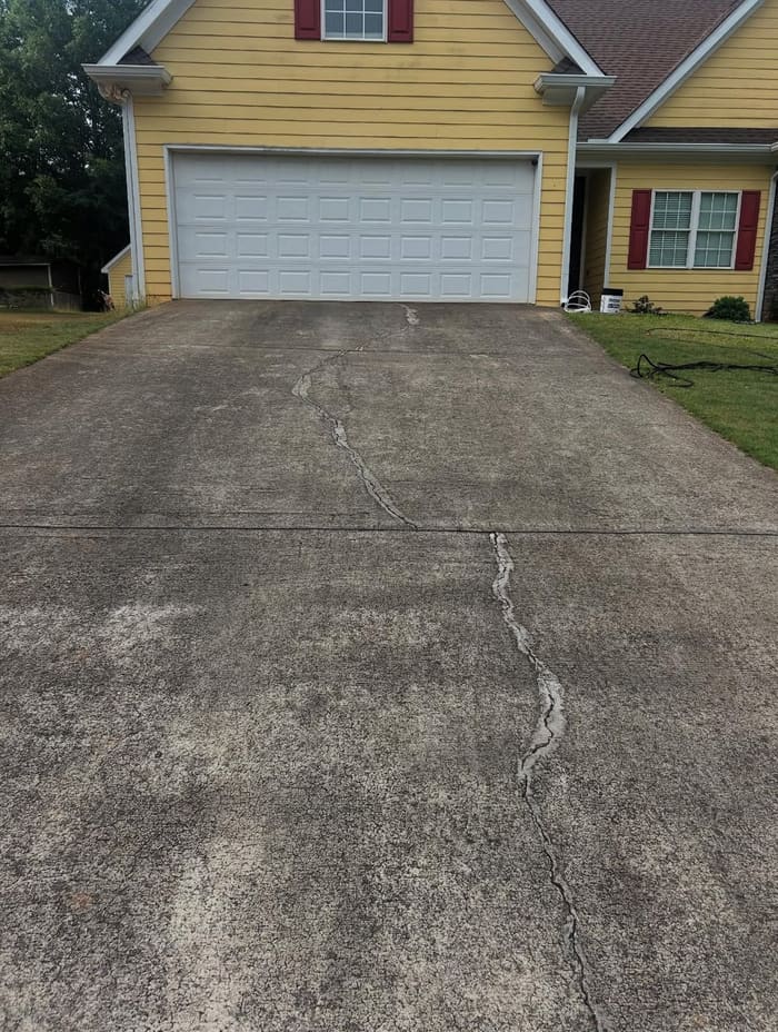 Dirty stained driveway before pressure washing in Athens, GA