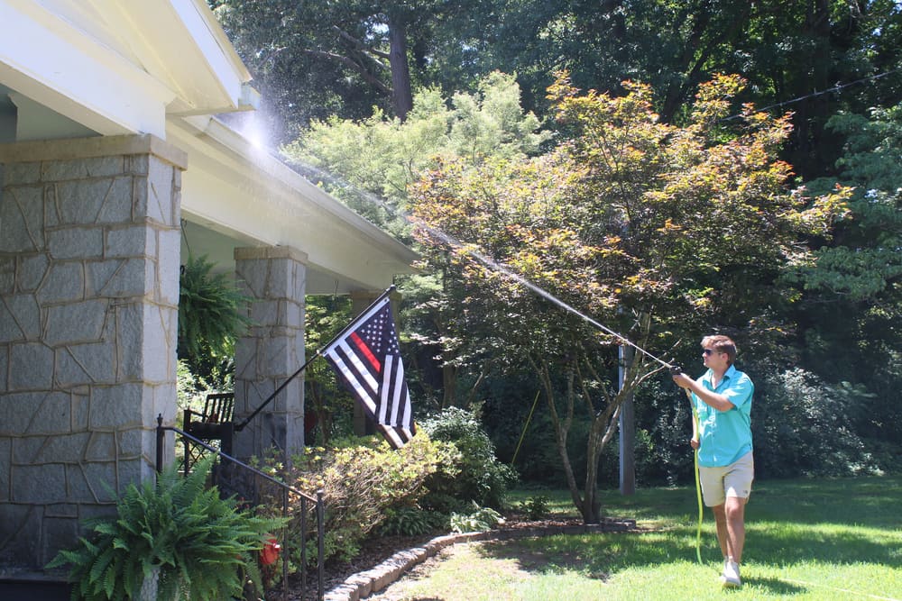 Home exterior being soft washed in Athens, GA